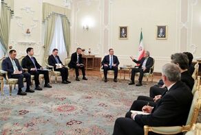Iran favors talks while it will never accept bullying